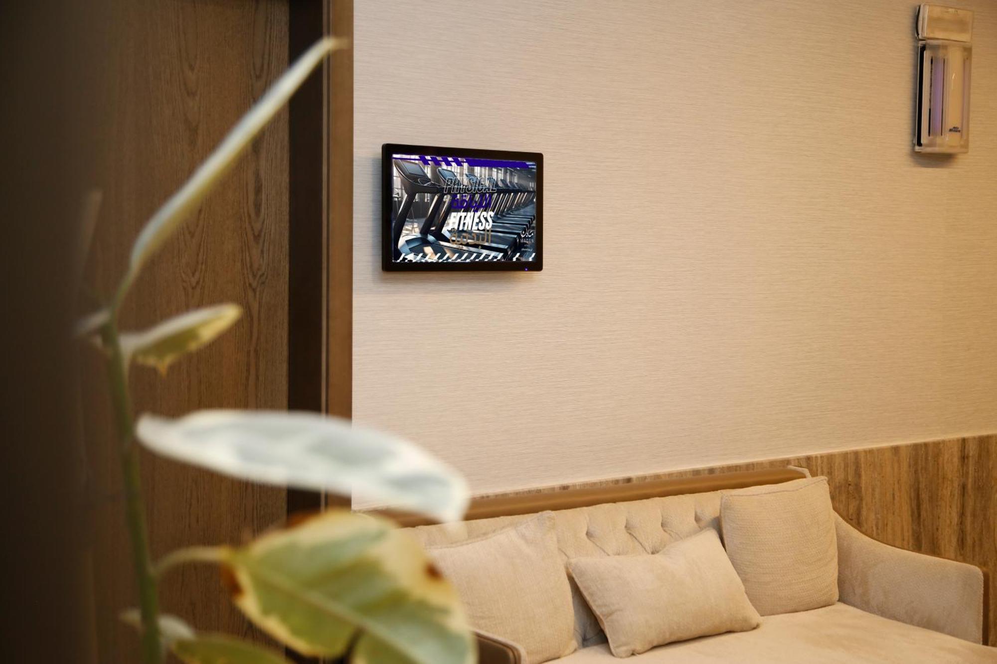 Maden Alrawda Hotel Medina Buitenkant foto A wall-mounted tablet